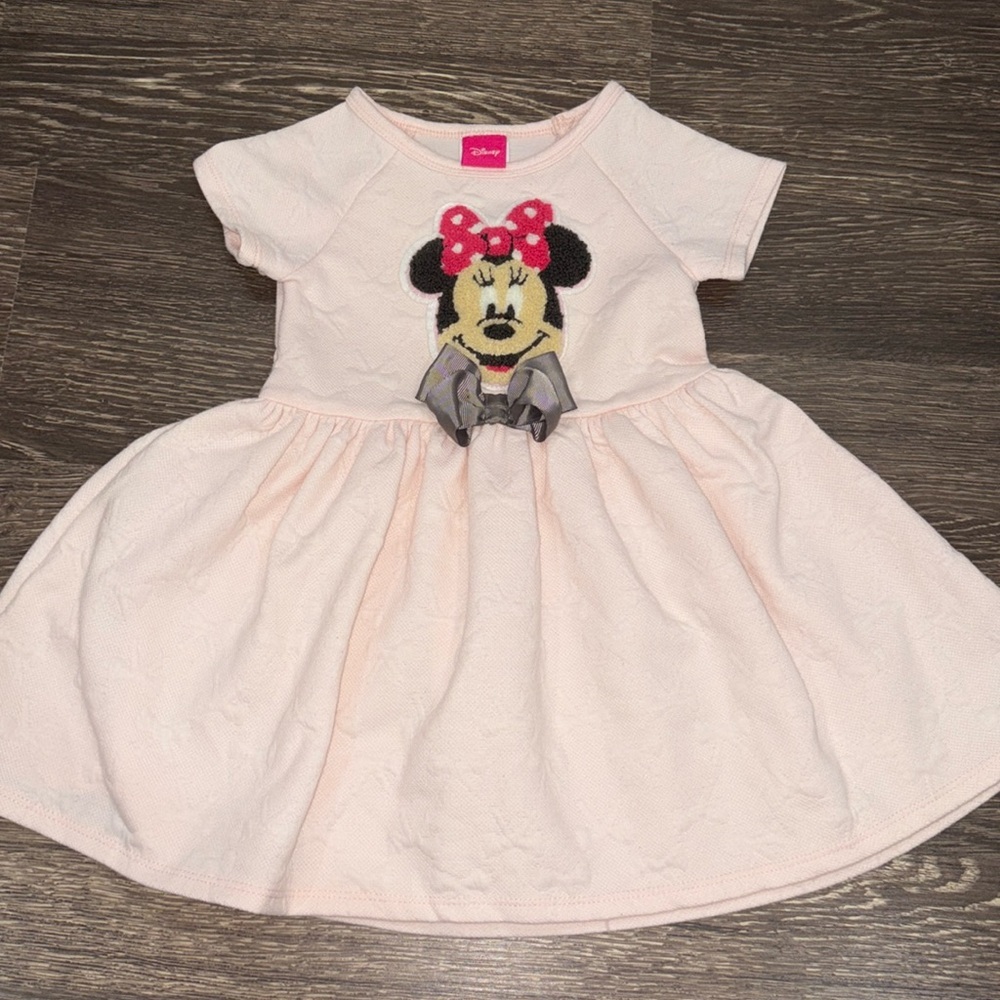 Disney light pink mini dress with a mini patch and bow detail throughout
